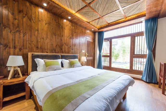 Imagen de la habitación del Hotel Lijiang Yue Tu Inn. Foto 7