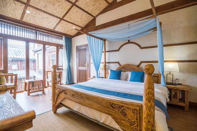 Imagen de la habitación del Hotel Lijiang Yue Tu Inn. Foto 11