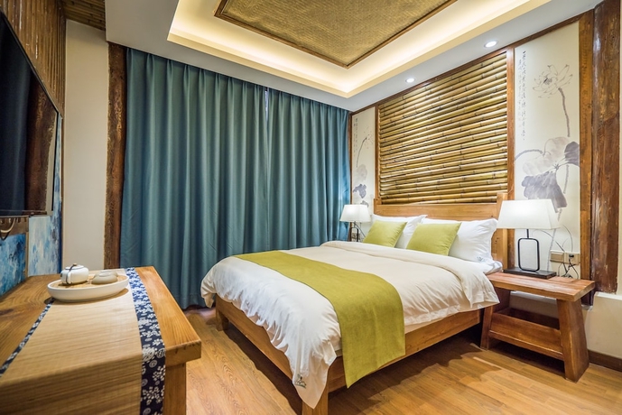 Imagen de la habitación del Hotel Lijiang Yue Tu Inn. Foto 12