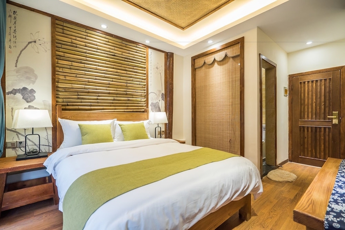 Imagen de la habitación del Hotel Lijiang Yue Tu Inn. Foto 13