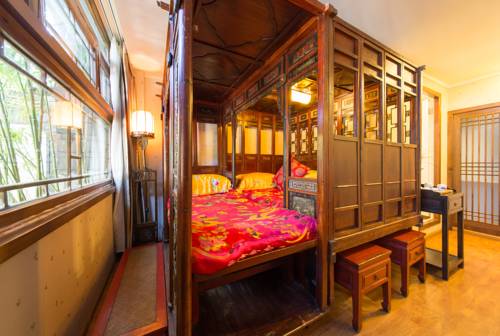 Imagen de la habitación del Hotel Lijiang Zen Garden. Foto 3