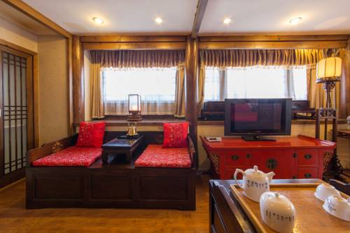 Imagen de la habitación del Hotel Lijiang Zen Garden. Foto 4