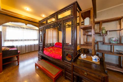 Imagen de la habitación del Hotel Lijiang Zen Garden. Foto 6