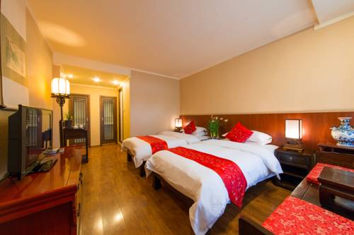 Imagen de la habitación del Hotel Lijiang Zen Garden. Foto 7