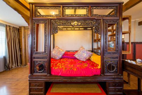 Imagen de la habitación del Hotel Lijiang Zen Garden. Foto 8