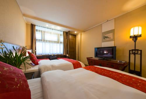 Imagen de la habitación del Hotel Lijiang Zen Garden. Foto 9