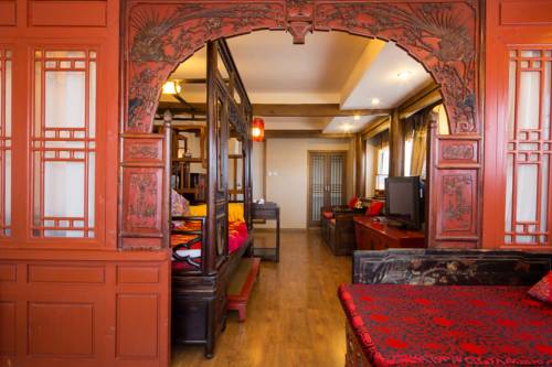 Imagen de la habitación del Hotel Lijiang Zen Garden. Foto 10