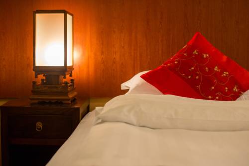 Imagen de la habitación del Hotel Lijiang Zen Garden. Foto 11