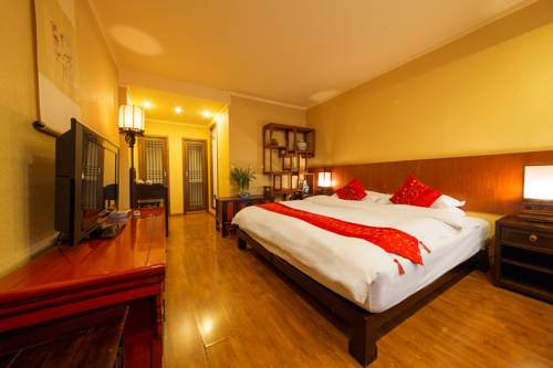 Imagen de la habitación del Hotel Lijiang Zen Garden. Foto 12