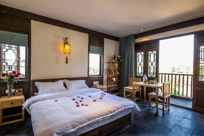 Imagen de la habitación del Hotel Lijiang Zhuyun Boutique. Foto 7