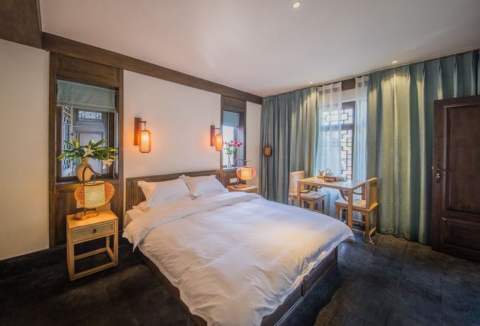 Imagen de la habitación del Hotel Lijiang Zhuyun Boutique. Foto 9