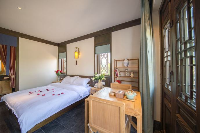 Imagen de la habitación del Hotel Lijiang Zhuyun Boutique. Foto 11