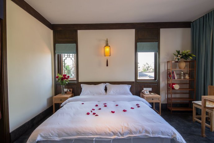 Imagen de la habitación del Hotel Lijiang Zhuyun Boutique. Foto 12