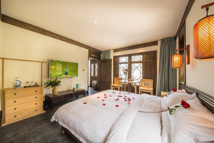 Imagen de la habitación del Hotel Lijiang Zhuyun Boutique. Foto 13