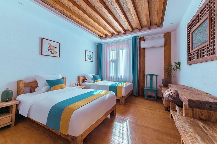 Imagen de la habitación del Hotel Lijiang half yard hotel. Foto 4