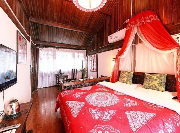 Imagen de la habitación del Hotel Lijiang shuimuxiquan Inn. Foto 7