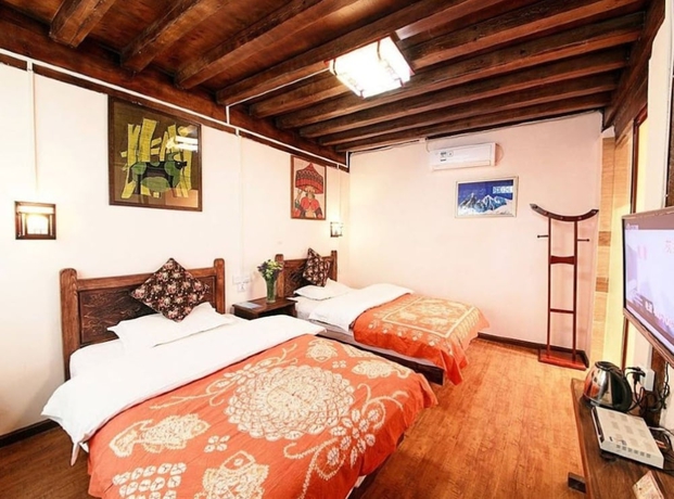 Imagen de la habitación del Hotel Lijiang shuimuxiquan Inn. Foto 9