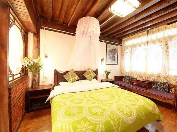 Imagen de la habitación del Hotel Lijiang shuimuxiquan Inn. Foto 11