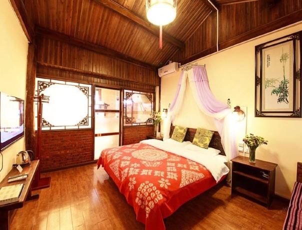 Imagen de la habitación del Hotel Lijiang shuimuxiquan Inn. Foto 12
