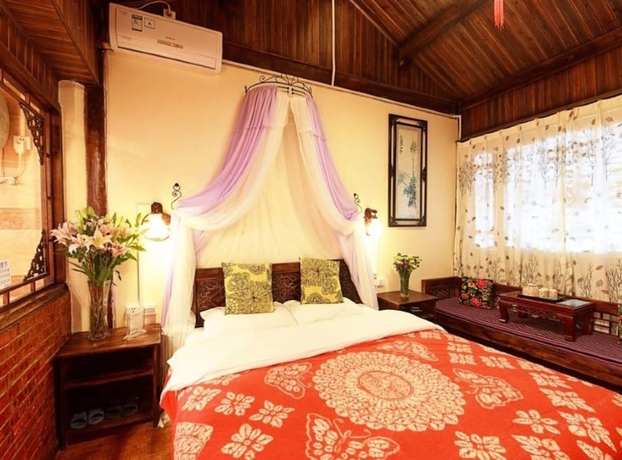 Imagen de la habitación del Hotel Lijiang shuimuxiquan Inn. Foto 13