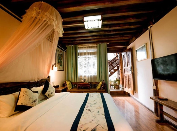 Imagen de la habitación del Hotel Lijiang shuimuxiquan Inn. Foto 14