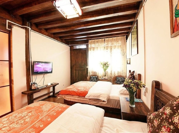 Imagen de la habitación del Hotel Lijiang shuimuxiquan Inn. Foto 16