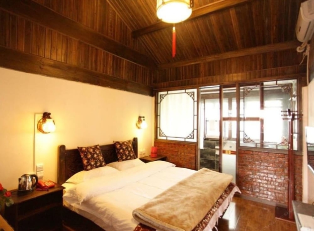 Imagen de la habitación del Hotel Lijiang shuimuxiquan Inn. Foto 17