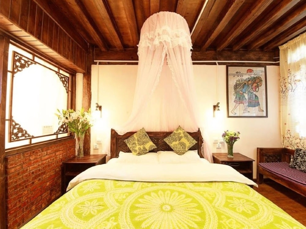 Imagen de la habitación del Hotel Lijiang shuimuxiquan Inn. Foto 18