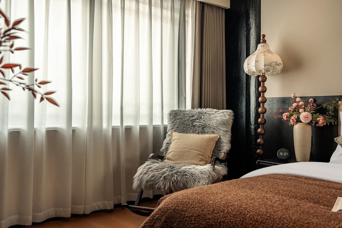 Imagen de la habitación del Hotel Lijing Yunman Mushanxue lnn. Foto 9