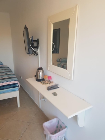 Imagen de la habitación del Hotel Lilly Rooms and Studios. Foto 11