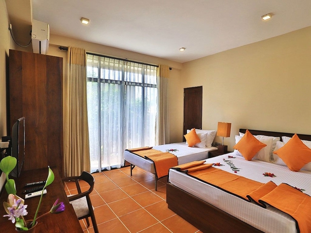 Imagen de la habitación del Hotel Lily\'s Resort. Foto 4