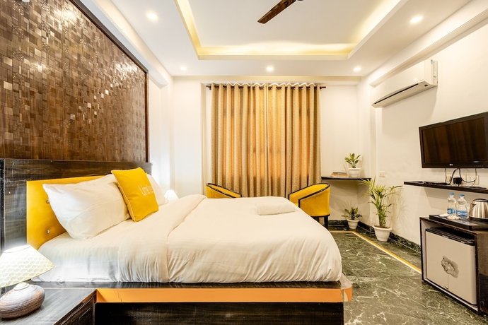 Imagen de la habitación del Hotel Lime Tree and Banquet Huda Metro. Foto 5