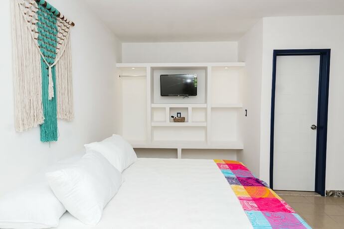 Imagen de la habitación del Hotel Linda Vecindad Playa del Carmen. Foto 12