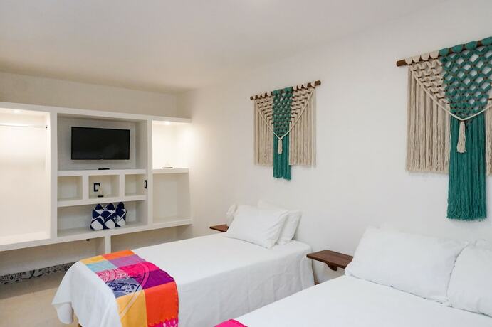 Imagen de la habitación del Hotel Linda Vecindad Playa del Carmen. Foto 14