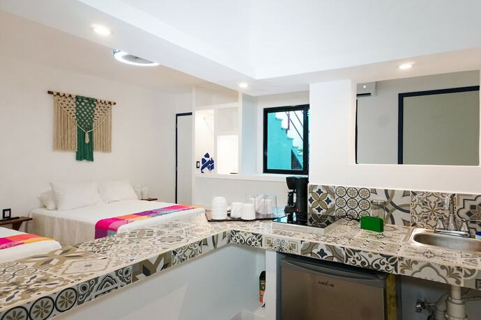 Imagen de la habitación del Hotel Linda Vecindad Playa del Carmen. Foto 15