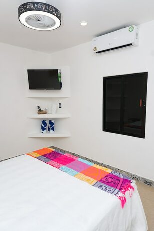 Imagen de la habitación del Hotel Linda Vecindad Playa del Carmen. Foto 17