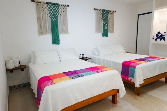 Imagen de la habitación del Hotel Linda Vecindad Playa del Carmen. Foto 18