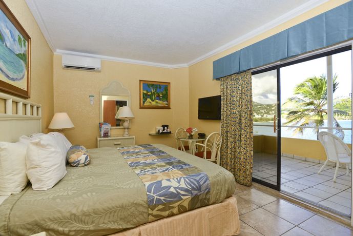 Imagen del bar/restaurante del Hotel Lindbergh Bay and Villas. Foto 2