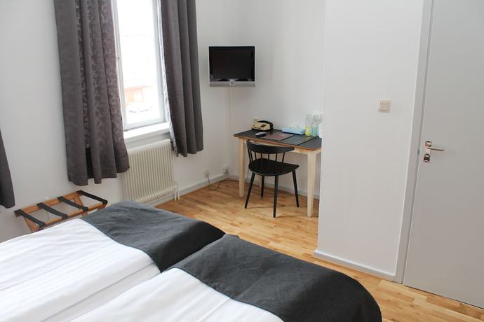 Imagen de la habitación del Hotel Lindesbergs Stadshotell. Foto 11