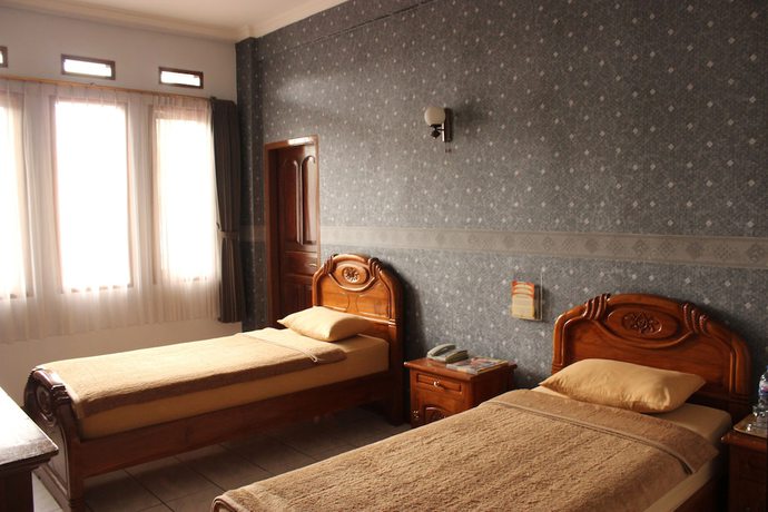 Imagen de la habitación del Hotel Lingga Hotel. Foto 8