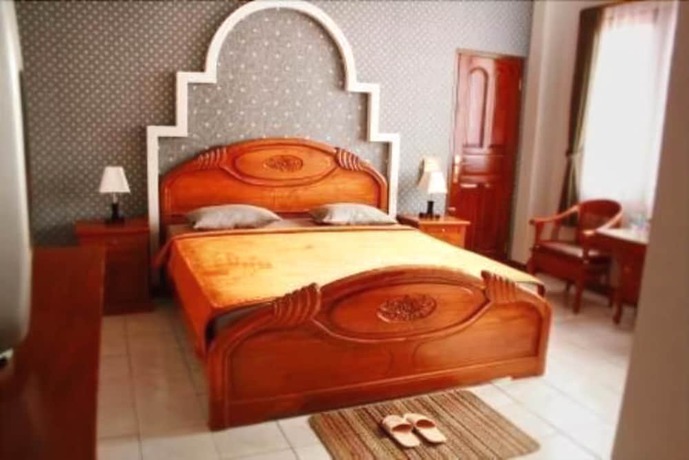 Imagen de la habitación del Hotel Lingga Hotel. Foto 17
