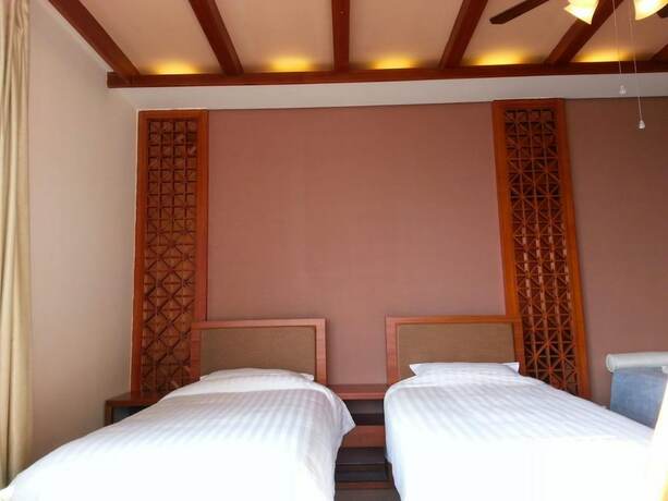 Imagen de la habitación del Hotel Lingshui Sea View Vacation Apartment. Foto 14