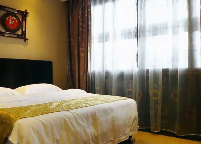 Imagen de la habitación del Hotel Lingxiu Impression Hotel. Foto 4