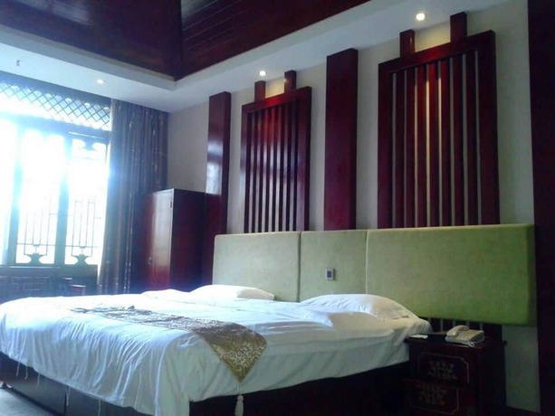 Imagen de la habitación del Hotel Lingxiu Impression Hotel. Foto 9