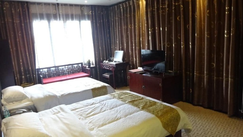 Imagen de la habitación del Hotel Lingxiu Impression Hotel. Foto 12