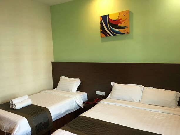 Imagen de la habitación del Hotel Lintas Plaza. Foto 18