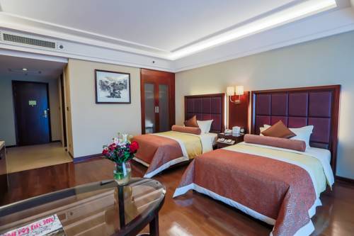 Imagen de la habitación del Hotel Linyin Holiday. Foto 2