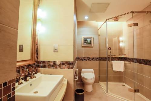 Imagen de la habitación del Hotel Linyin Holiday. Foto 4