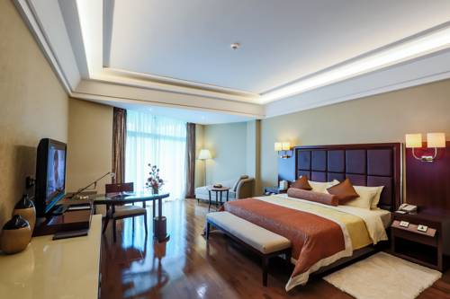 Imagen de la habitación del Hotel Linyin Holiday. Foto 5
