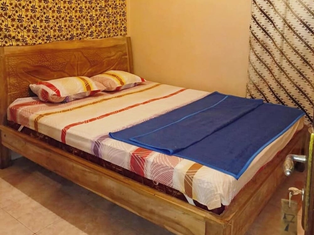 Imagen de la habitación del Hotel Lishafa Homestay. Foto 4